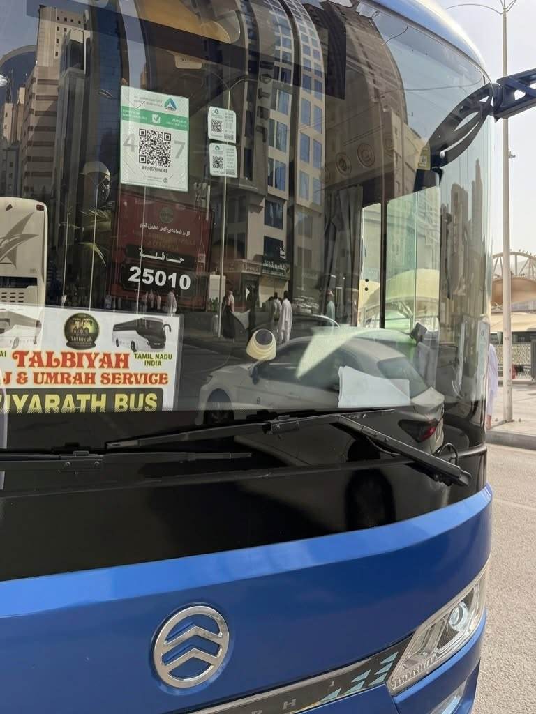 The coach used for ziyarat, with the Talbiyah Haj & Umrah Service board in the windscreen.