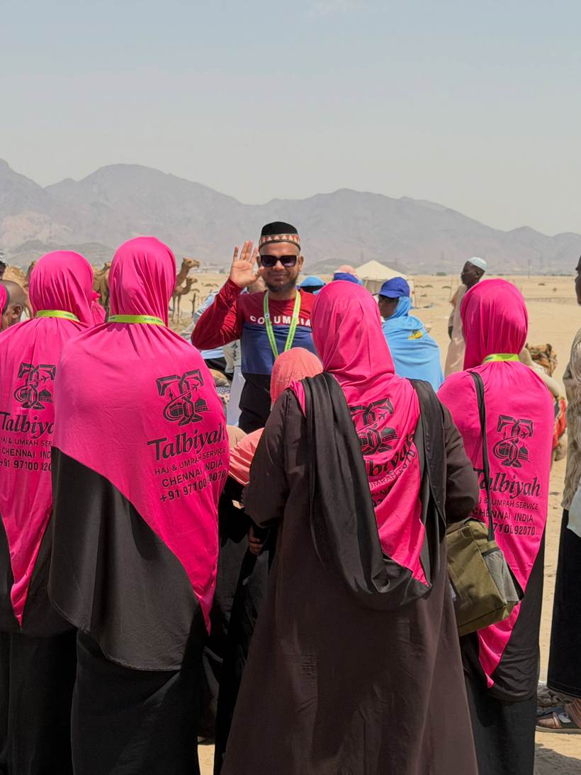 The group on ziyarat outside the city, the guide leading from the front.